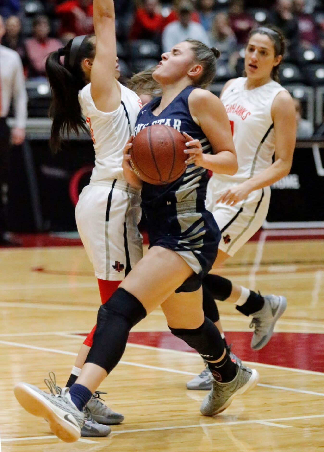 Lone Star High School forward Adryana Quezada (3) collides with Liberty High School guard...