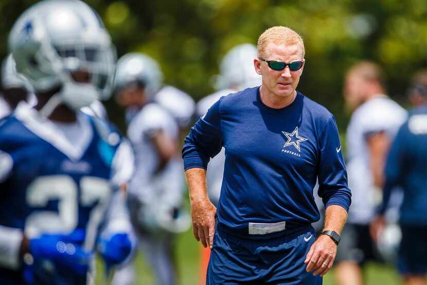 Dallas Cowboys head coach Jason Garrett watches his team practice during the team's minicamp...