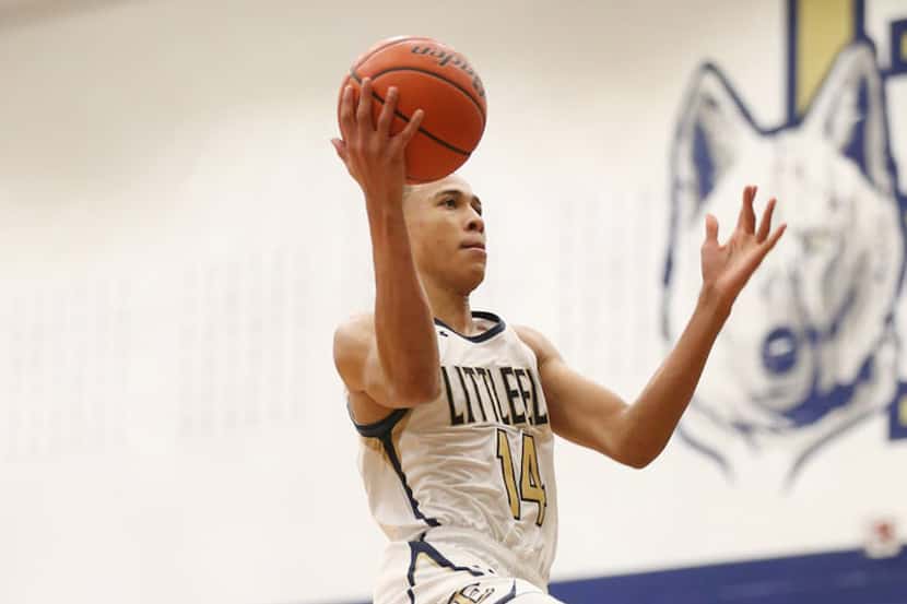 FILE - RJ Hampton scores on South Garland during the fourth quarter of a game at Little Elm...