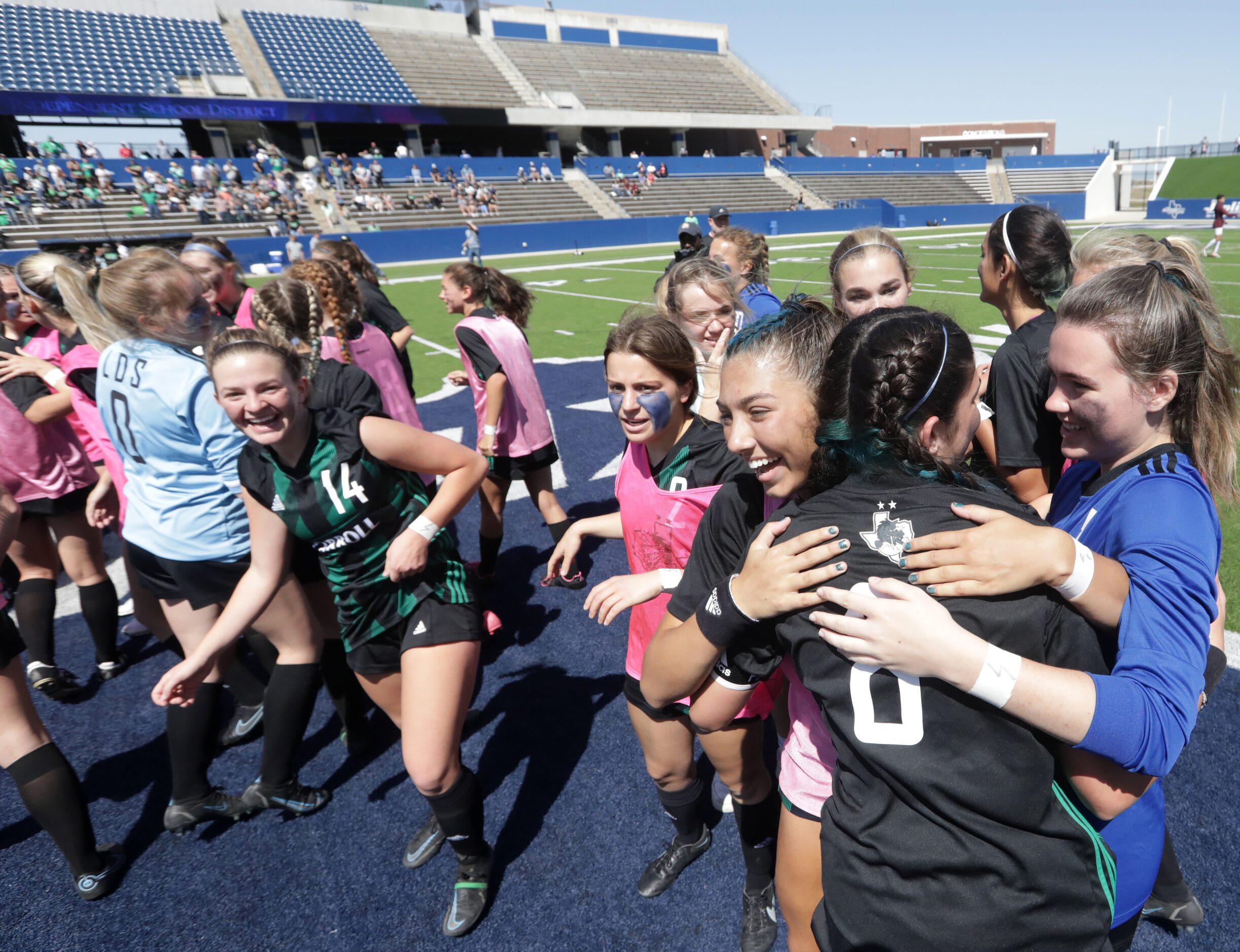 Southlake Carroll players celebrate after winning during a Class 6A Region I championship...