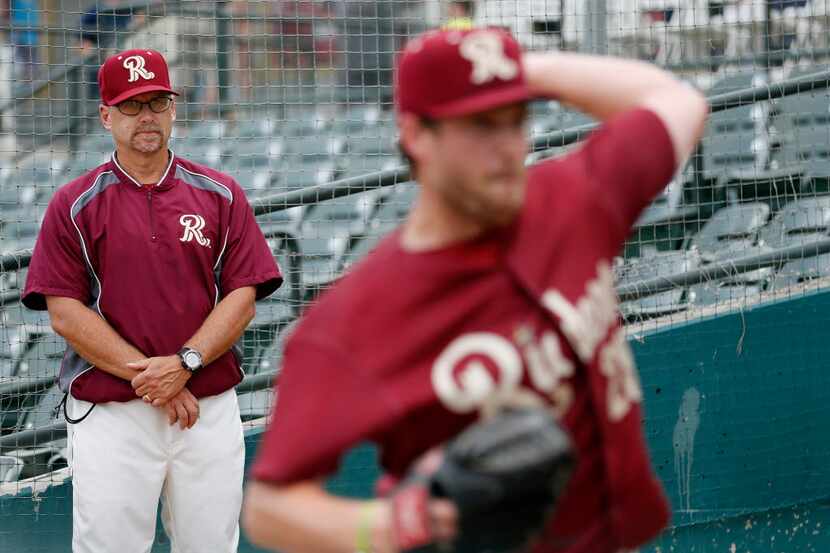 Frisco Roughriders pitching coach Jeff Andrews observes starting pitcher Chad Bell in the...