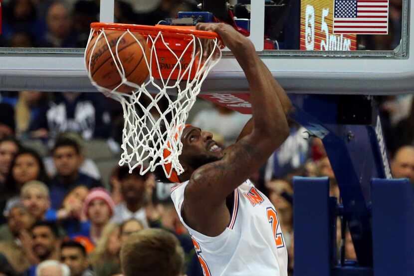 New York Knicks center Mitchell Robinson (26) lands a dunk against Dallas Mavericks forward...
