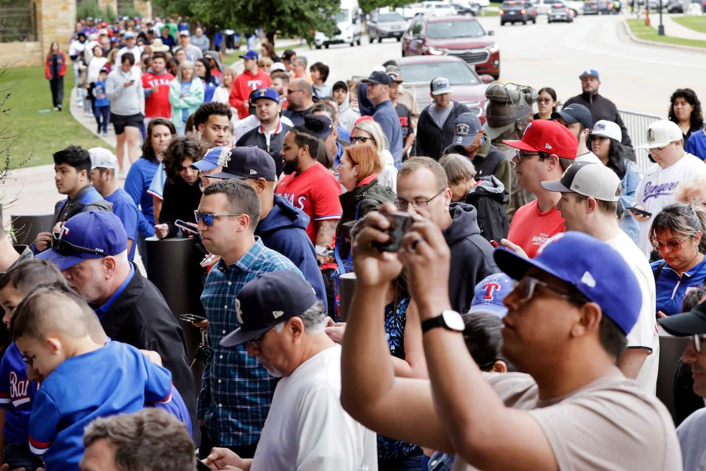 As doors opened to Globe Life Field in Arlington, Texas, Rangers fans lined up to get one of...