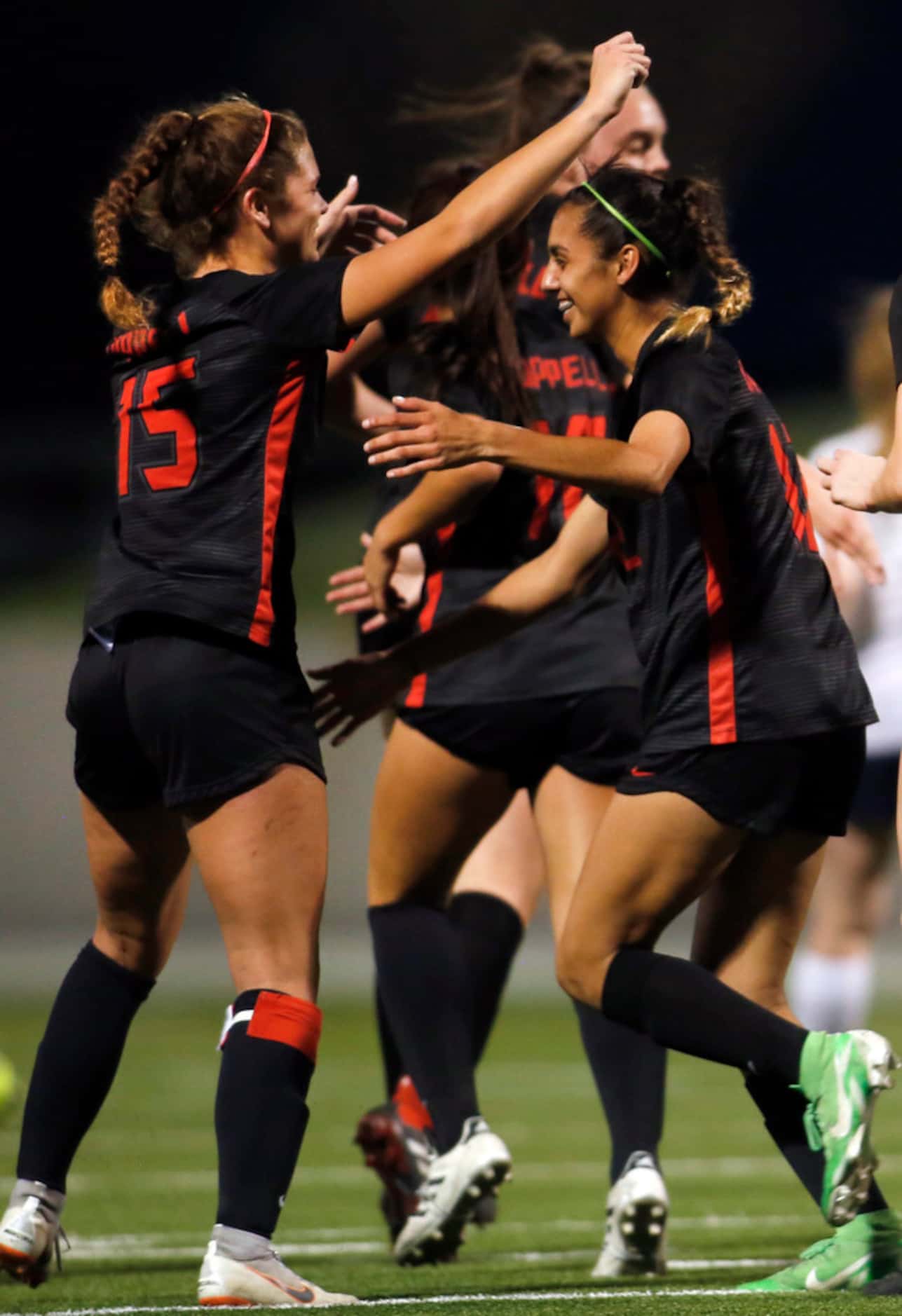 Coppell's Jocelyn Alonzo (12), right, was all smiles as she receives a congratulatory hug...