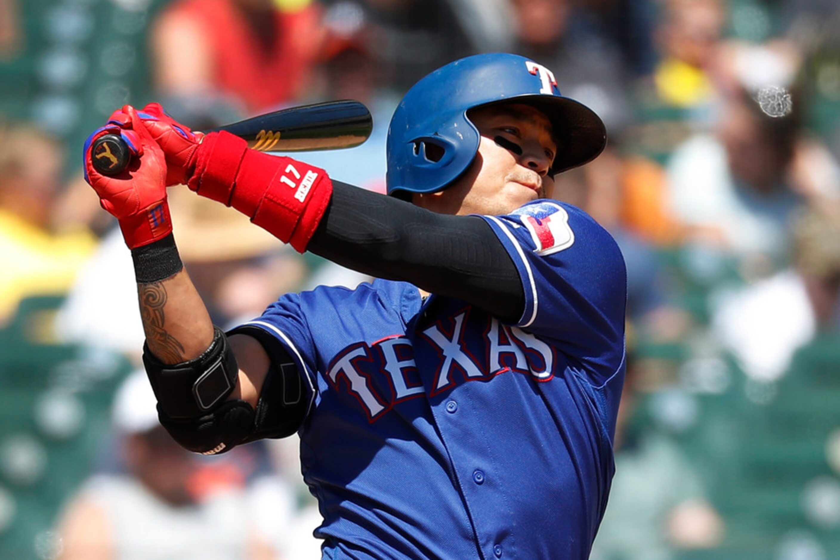 Texas Rangers' Shin-Soo Choo hits a sacrifice fly to score Rougned Odor in the seventh...