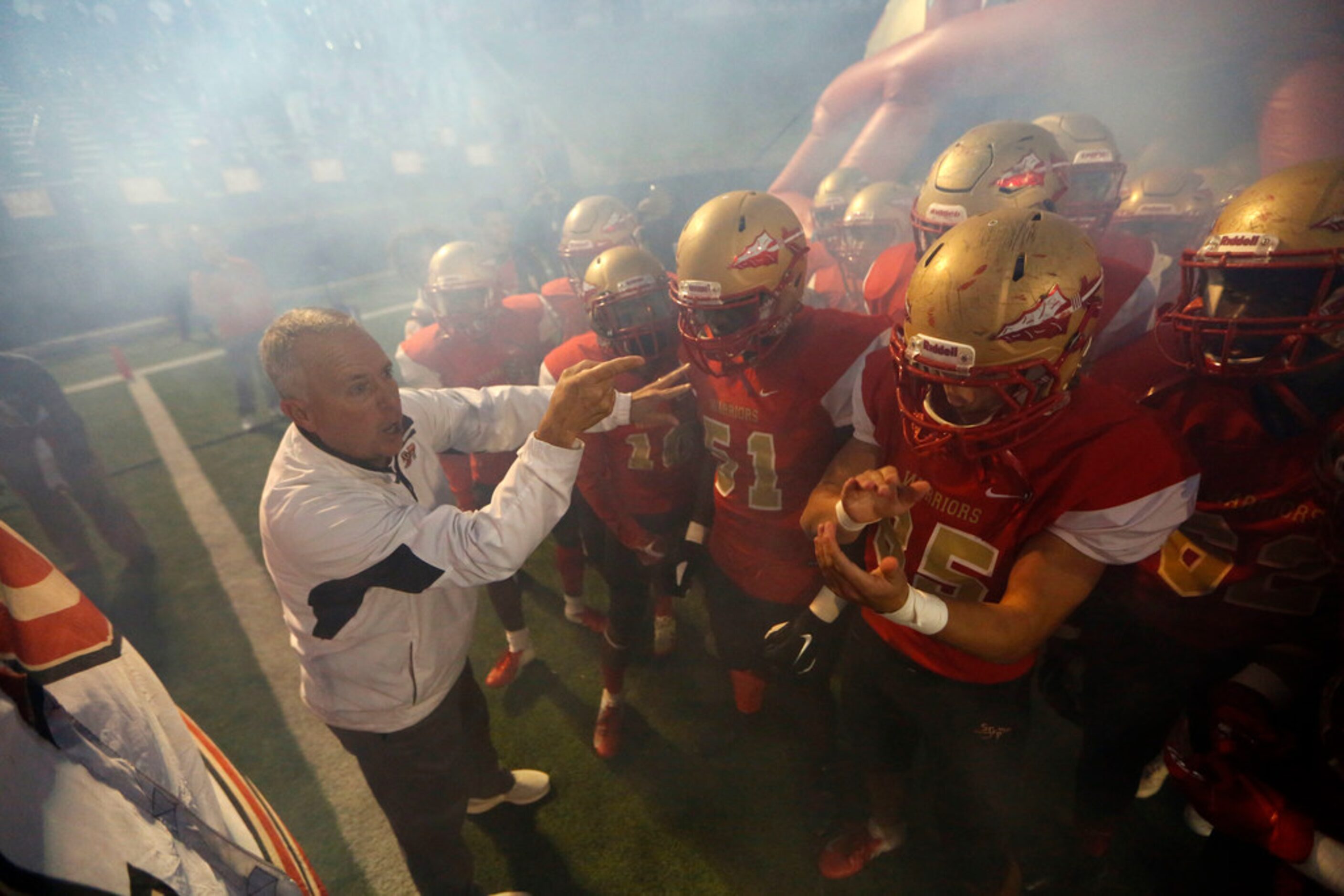 South Grand Prairie's head coach Brent Whitson pumps up his team before their game against...