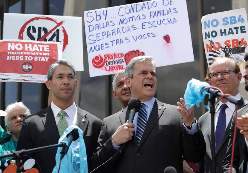 Austin Mayor Steve Adler (center) said Sen. John Cornyn's new border security legislation —...