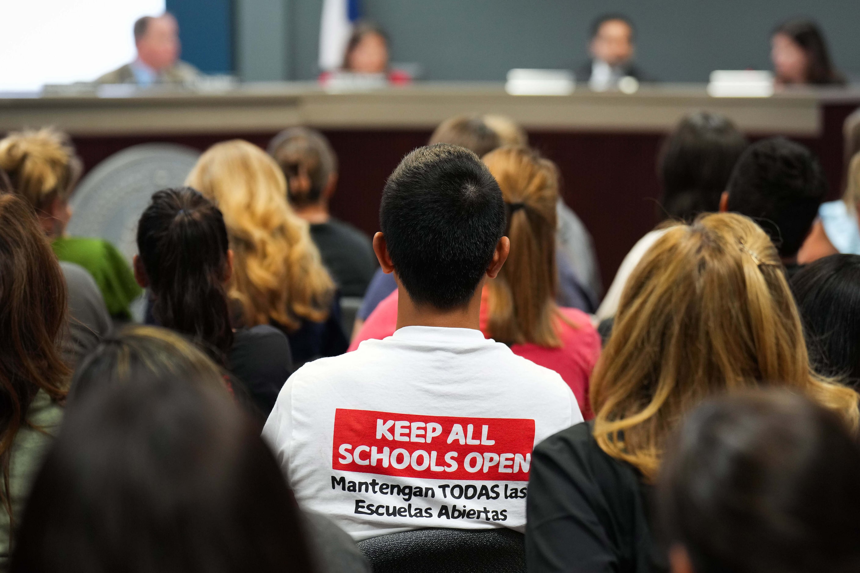 Opponents listen to discussion of a proposal to close Pinkerton Elementary School during a...