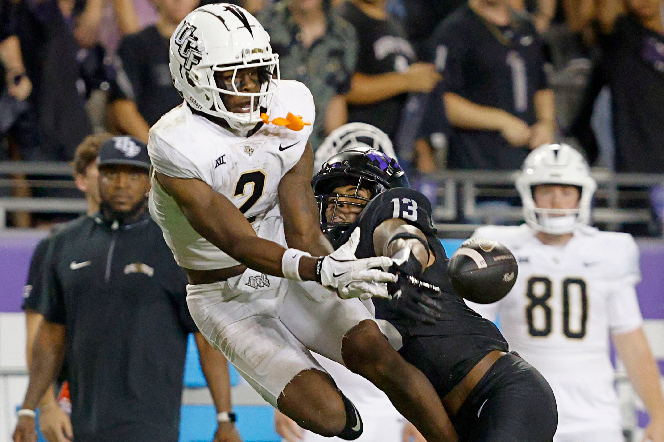 UCF wide receiver Kobe Hudson (2) fails to make the catch against TCU cornerback JaTravis...