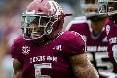 Texas A&M Aggies running back Trayveon Williams (5) celebrates after running to the end zone...