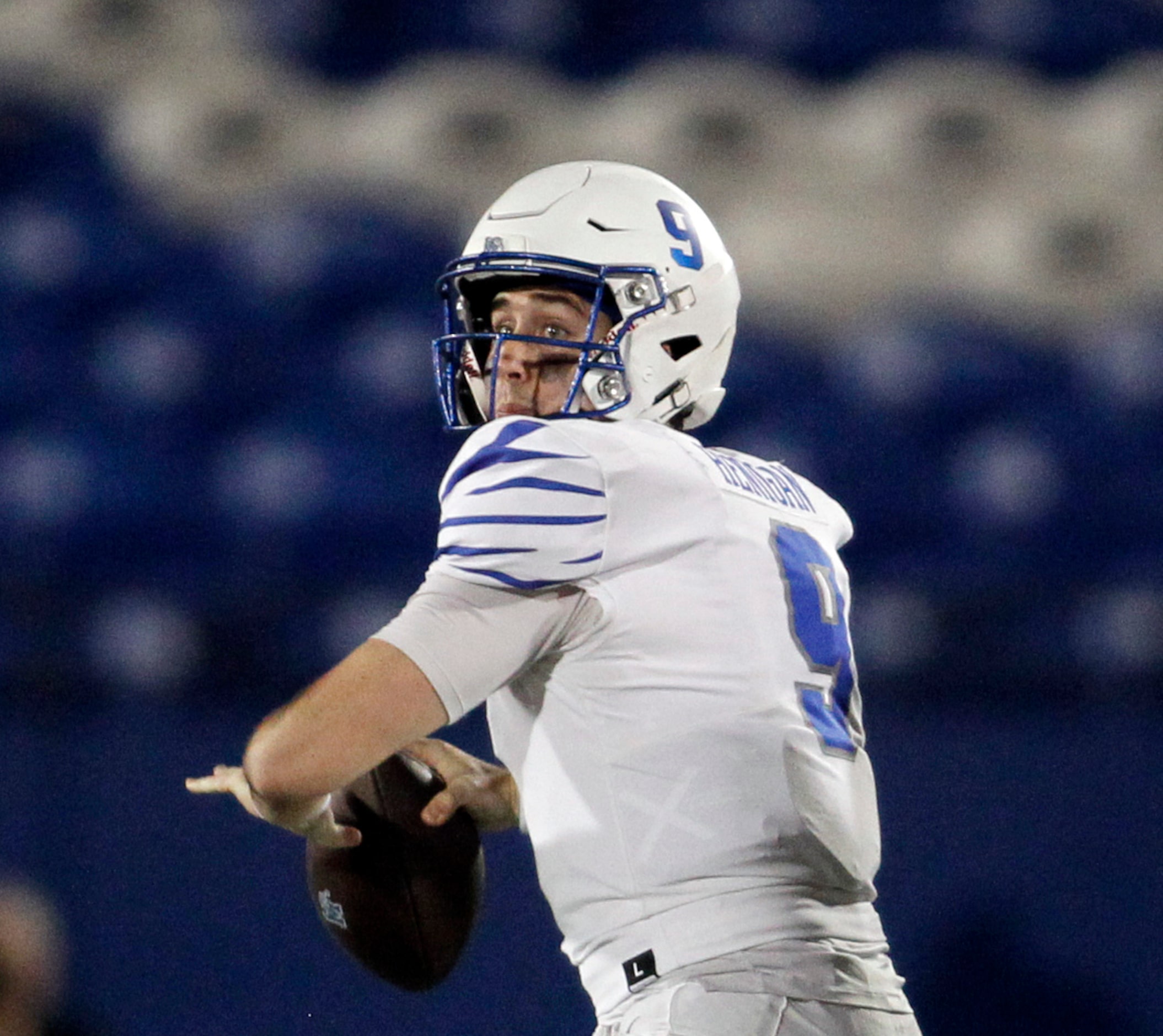 Memphis quarterback Seth Henigan (9) looks to pass downfield during second quarter action...