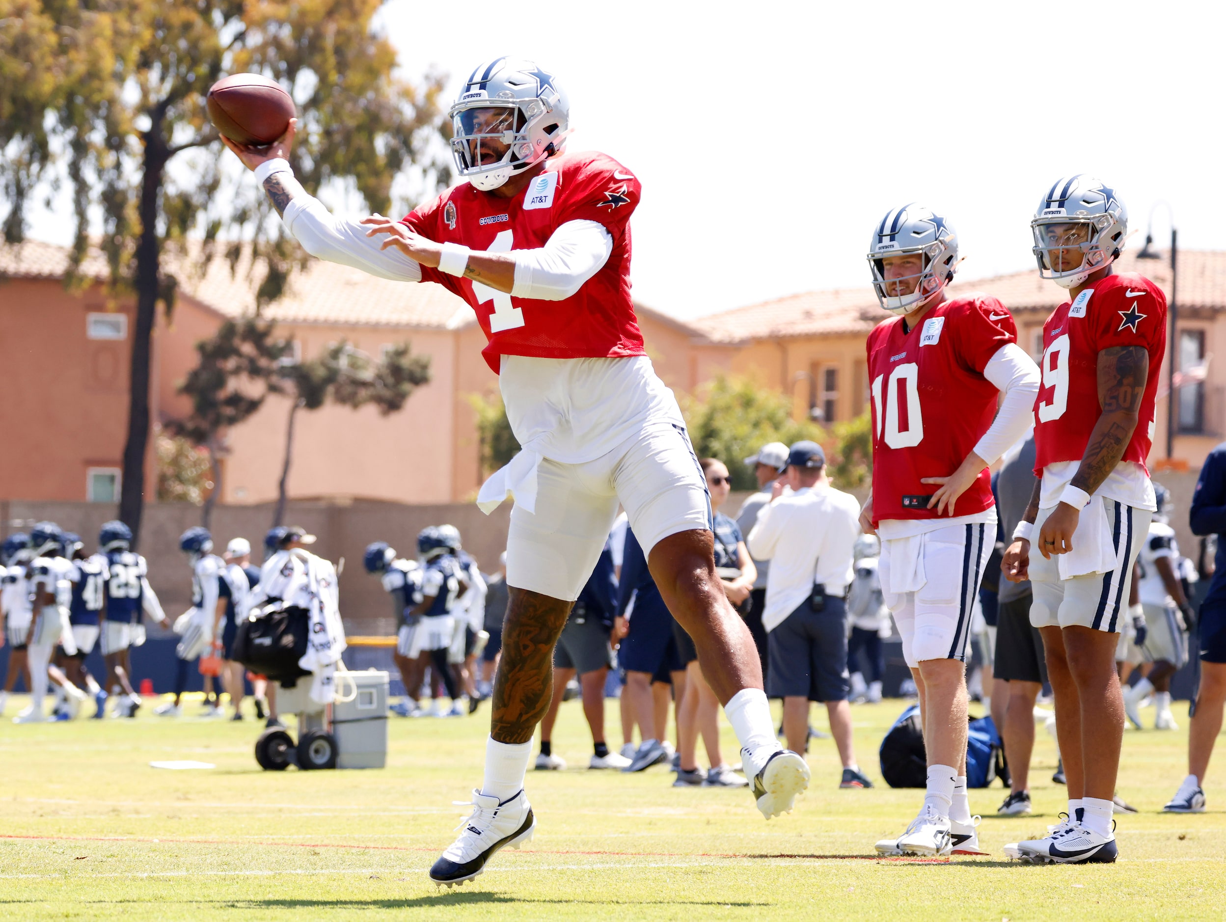 Dallas Cowboys quarterback Dak Prescott (4) throws to a target as he rolls out during...