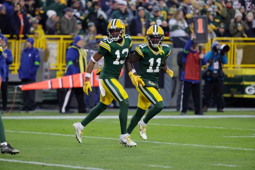 Green Bay Packers wide receiver Jayden Reed (11) and Dontayvion Wicks (13) during an NFL...