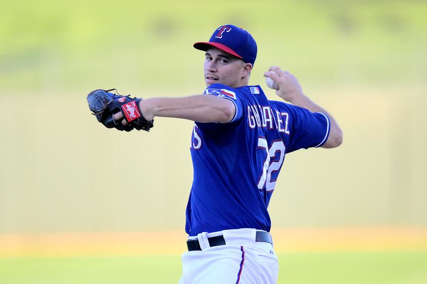 Mar 23, 2015; Surprise, AZ, USA; Texas Rangers starting pitcher Alex Gonzalez (72) pitches...