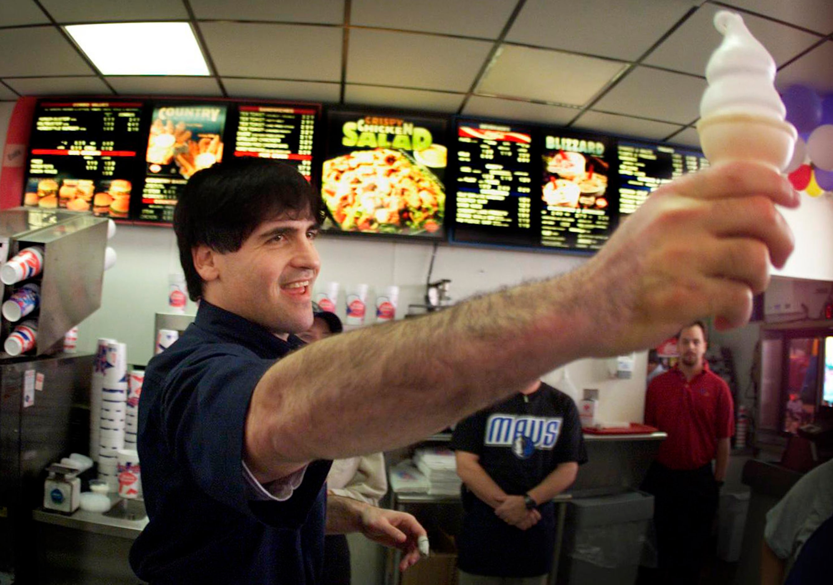 January 16, 2002: Dallas Mavericks owner Mark Cuban serves up a soft-serve cone during his...