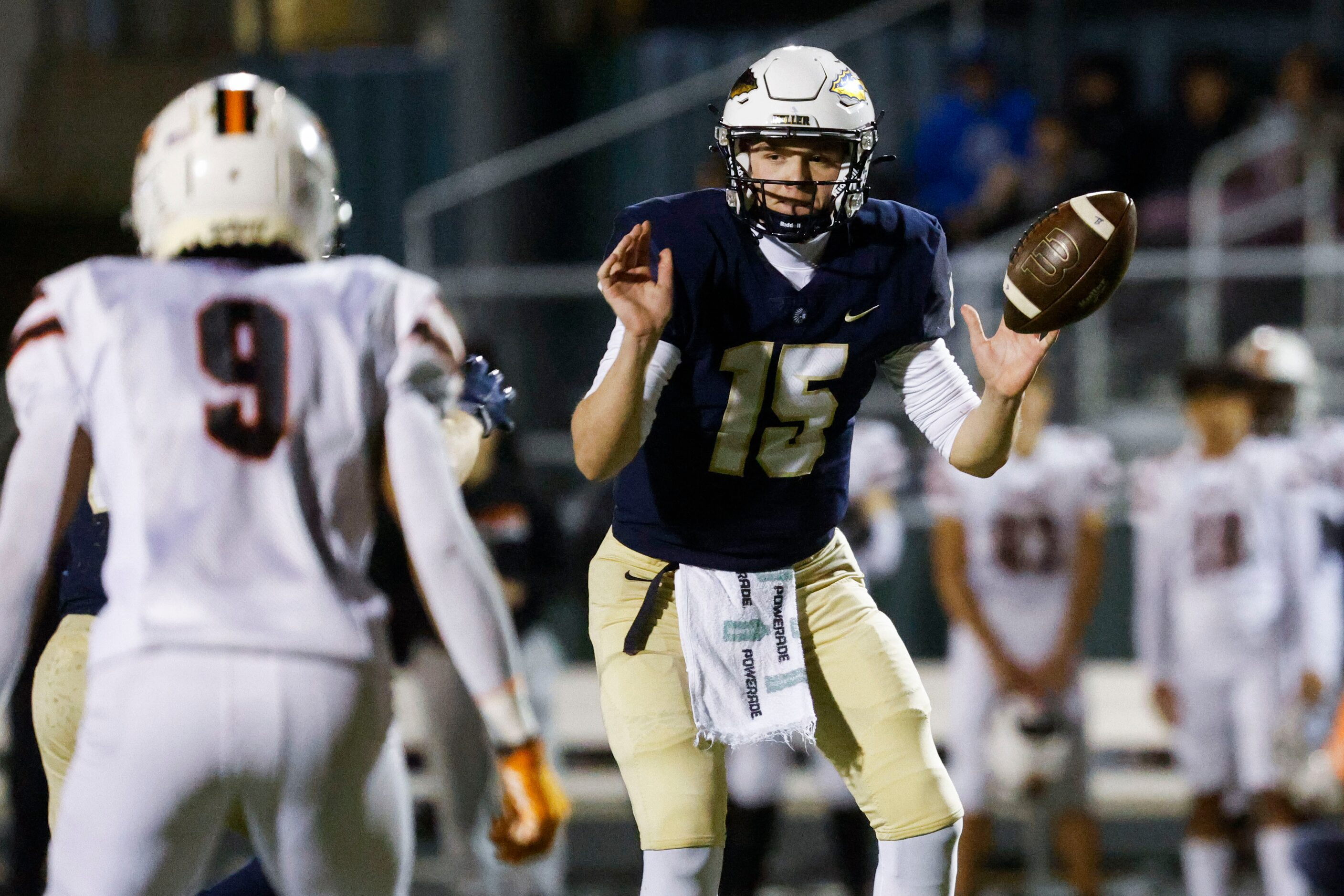 Keller high’s Beckham Robinson (15) looks to hand off the ball against Haltom high during...