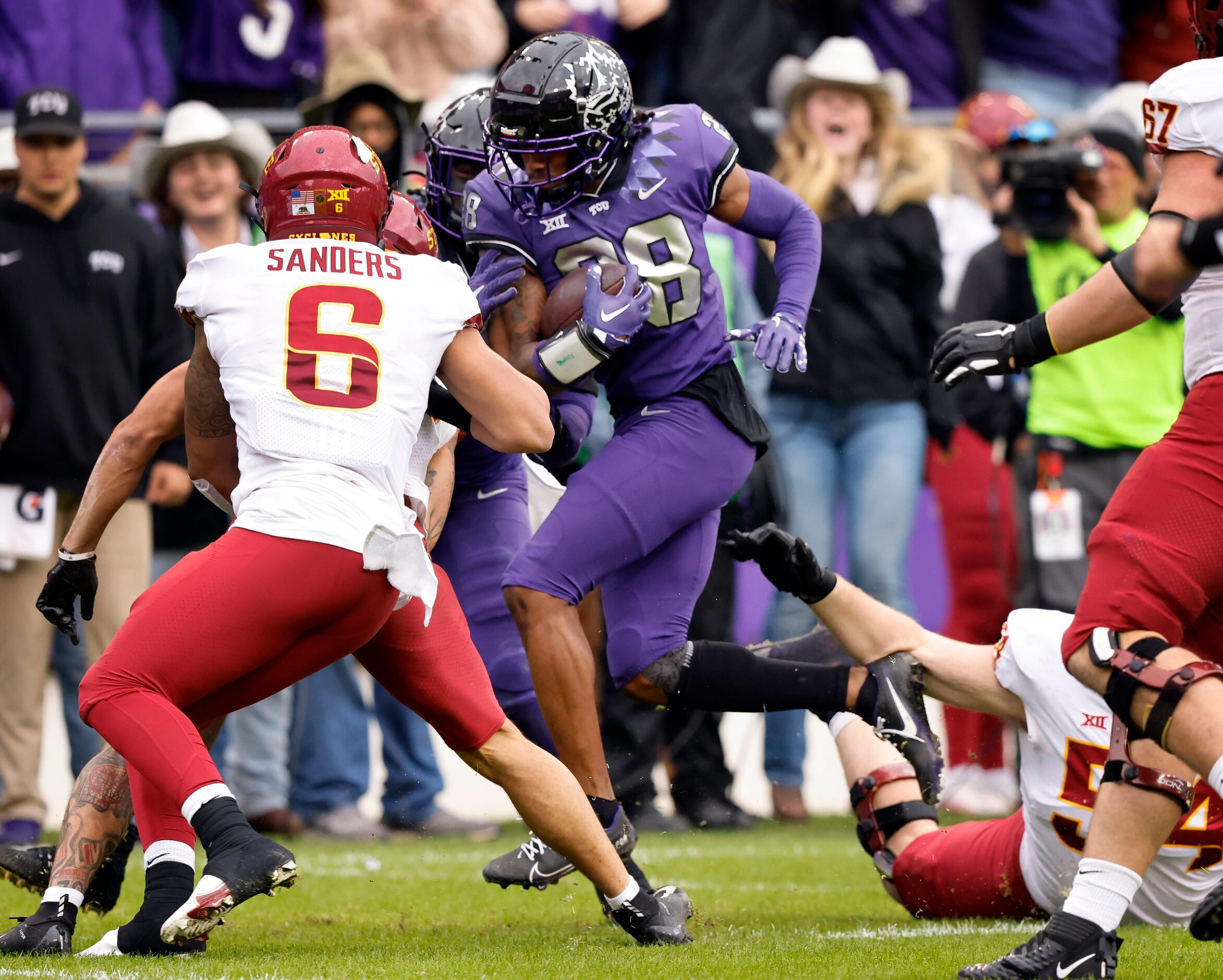 TCU Horned Frogs safety Millard Bradford (28) returns an Iowa State Cyclones interception...