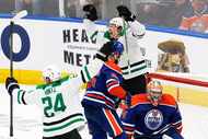 Dallas Stars left wing Jason Robertson (21) celebrated with his teammate center Roope Hintz...