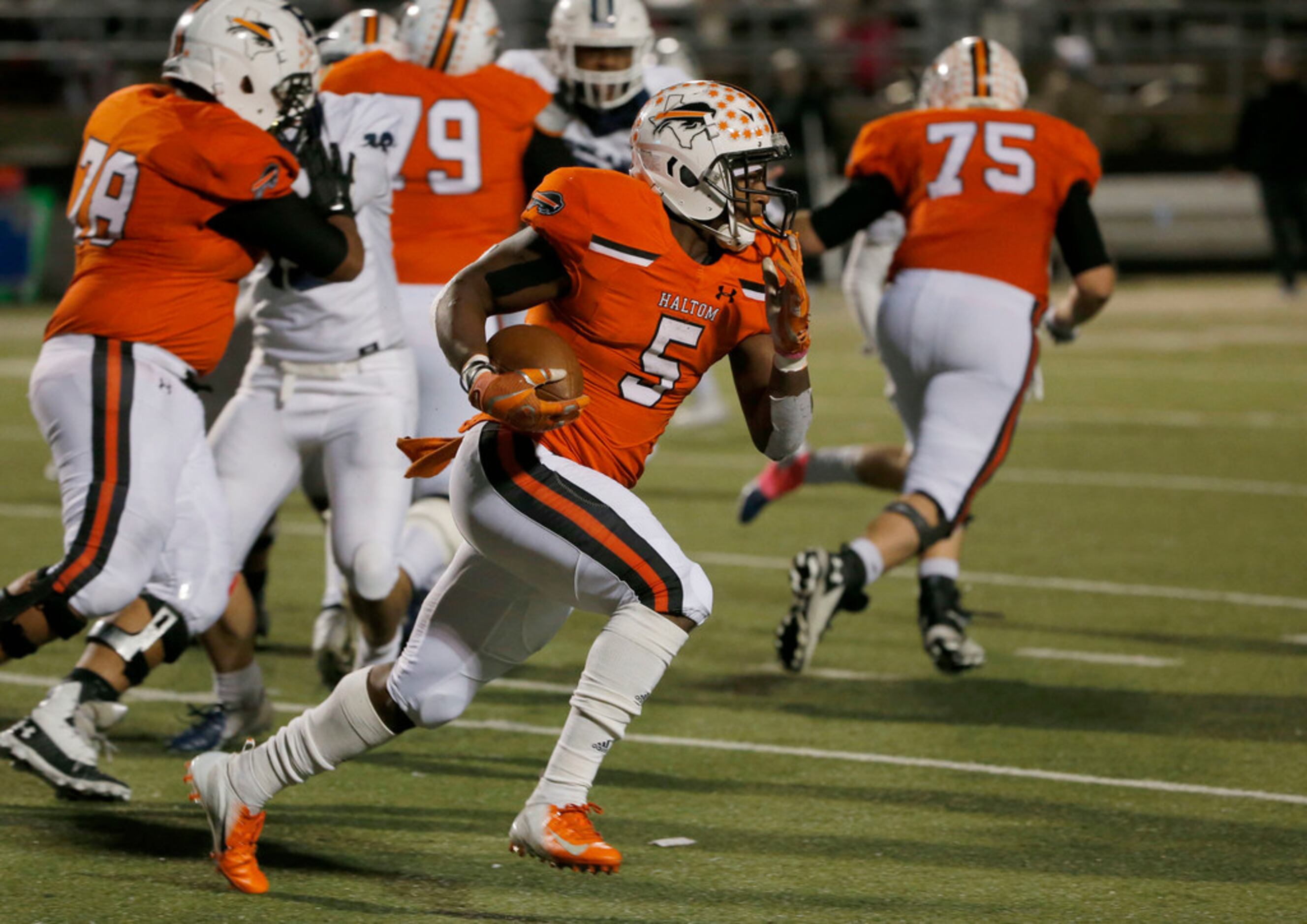 Haltom's Kenneth Cormier Jr. (5) runs against Richland during the second half of their high...