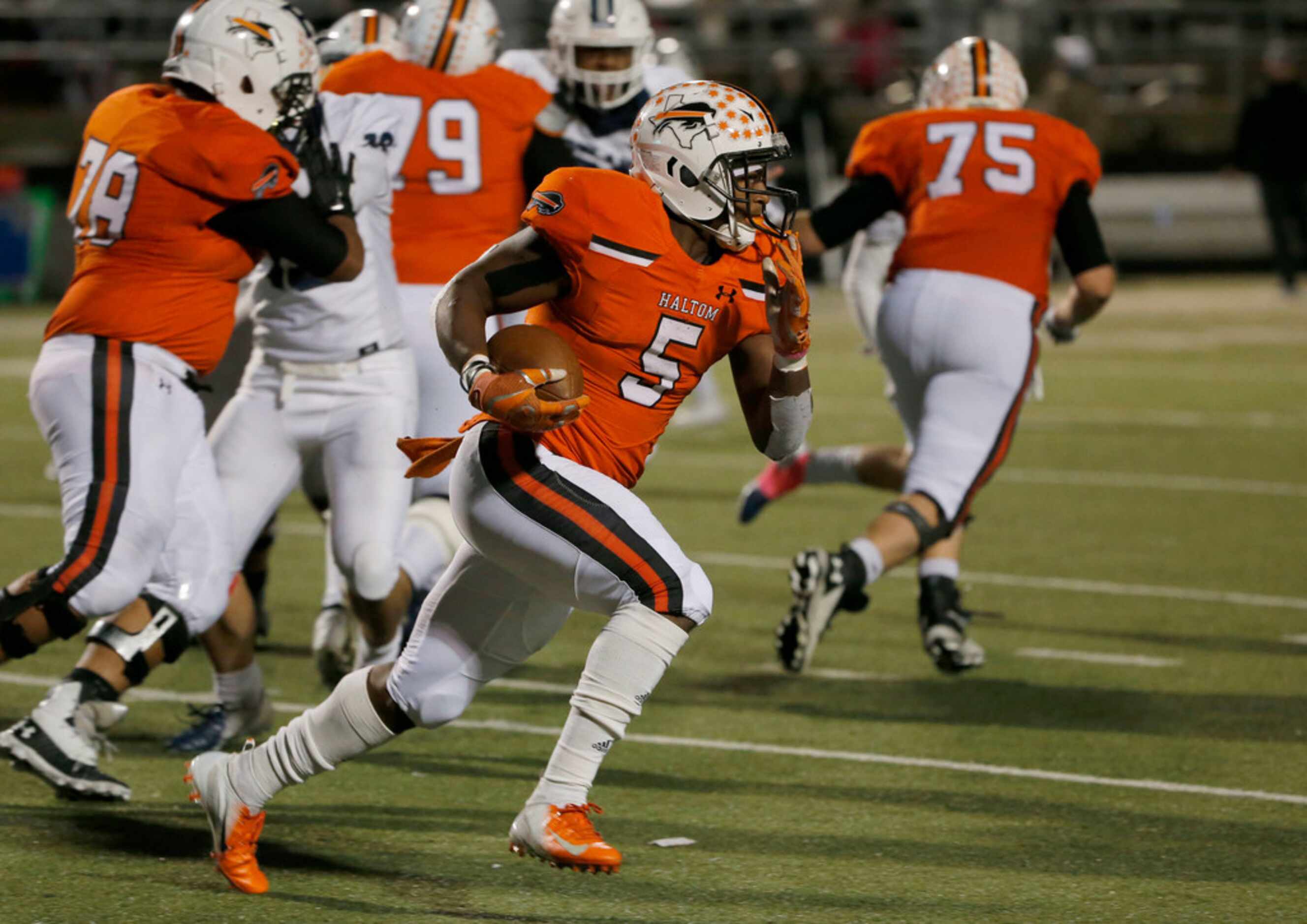 Haltom's Kenneth Cormier Jr. (5) runs against Richland during the second half of their high...