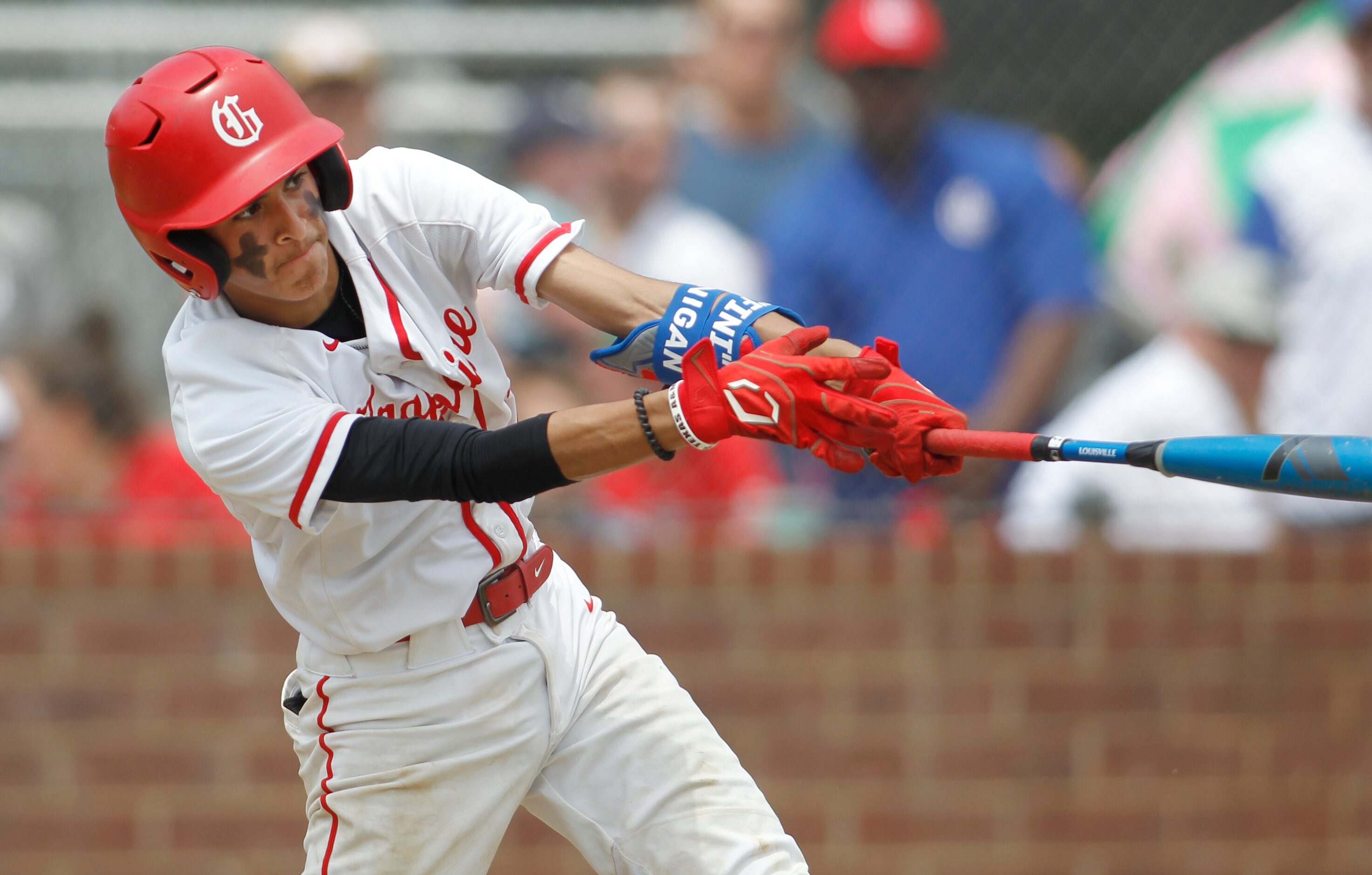 Grapevine's Gianni Corral (12) hits an RBI single during the bottom of the 4th inning of...