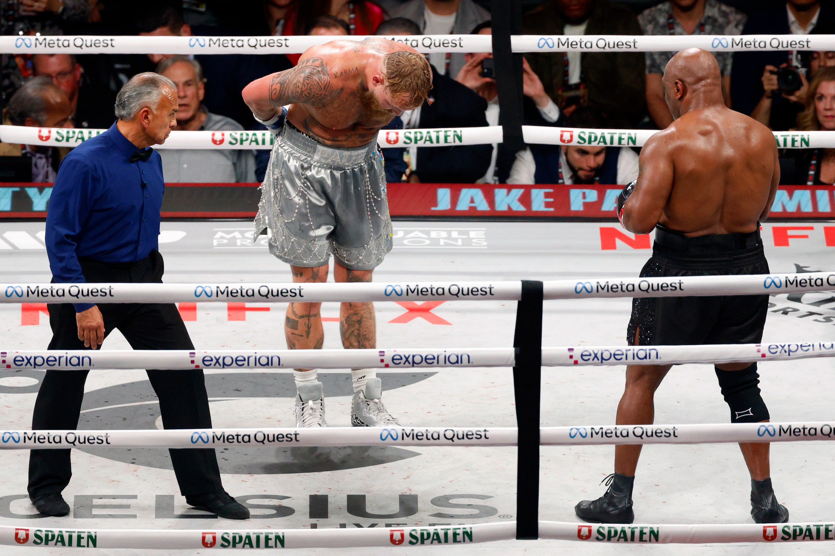 Jake Paul bows to Mike Tyson during the closing seconds of round eight of a heavyweight...