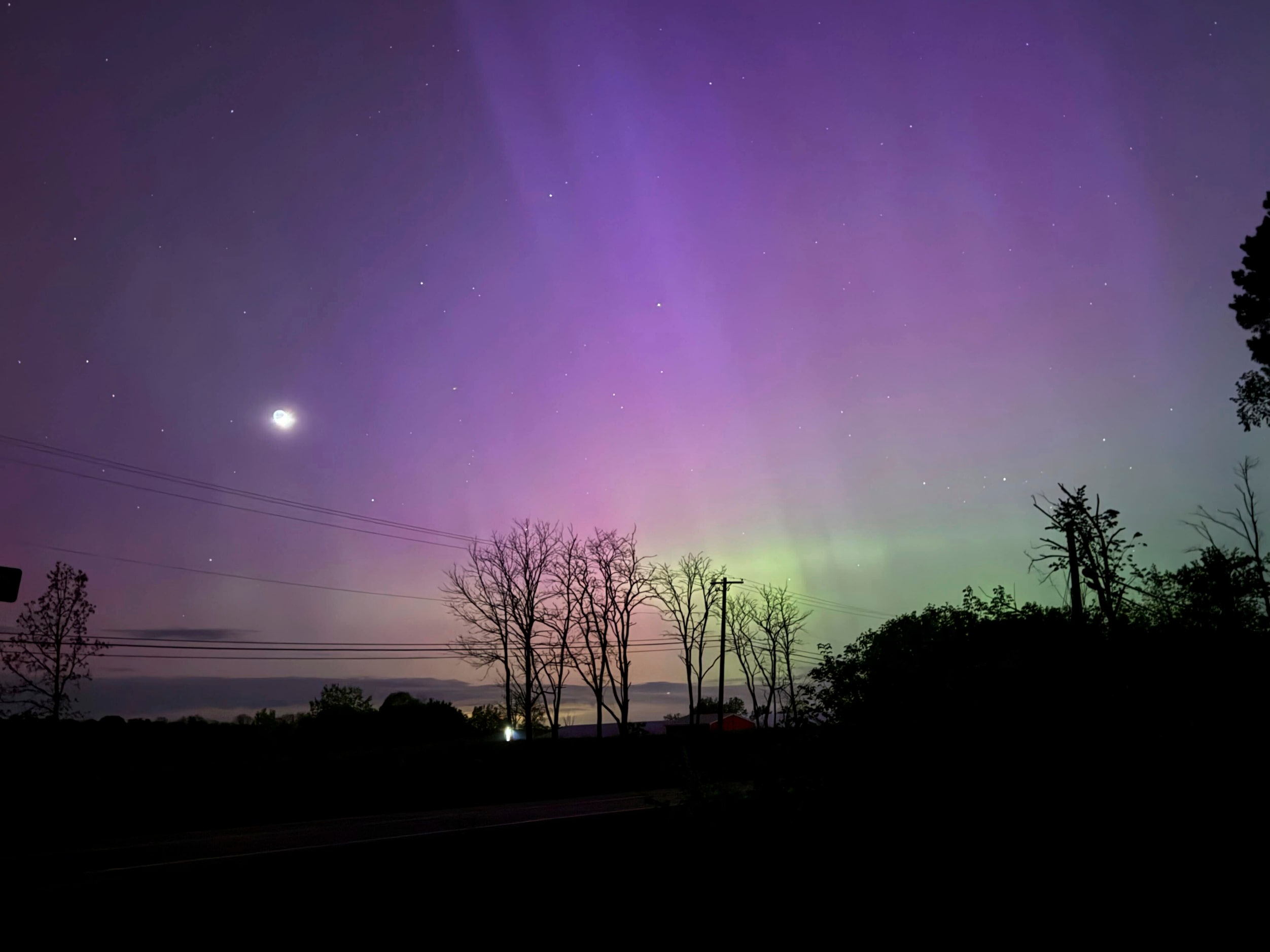 The Aurora Borealis, also known as the Northern Lights, is visible over Ann Arbor, Mich.,...