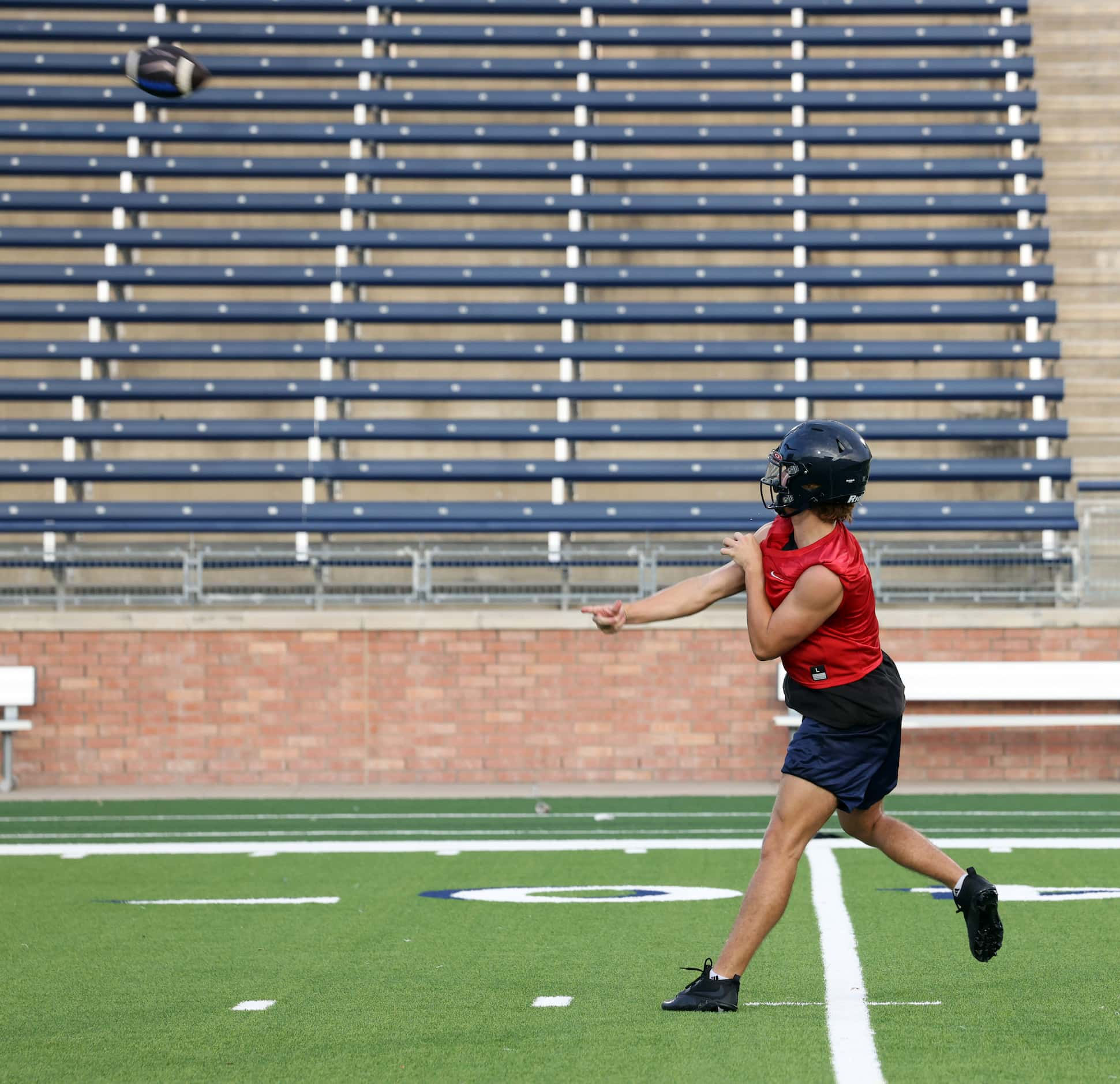 Allen quarterback Brady Bricker launches a long pass downfield during an early morning...