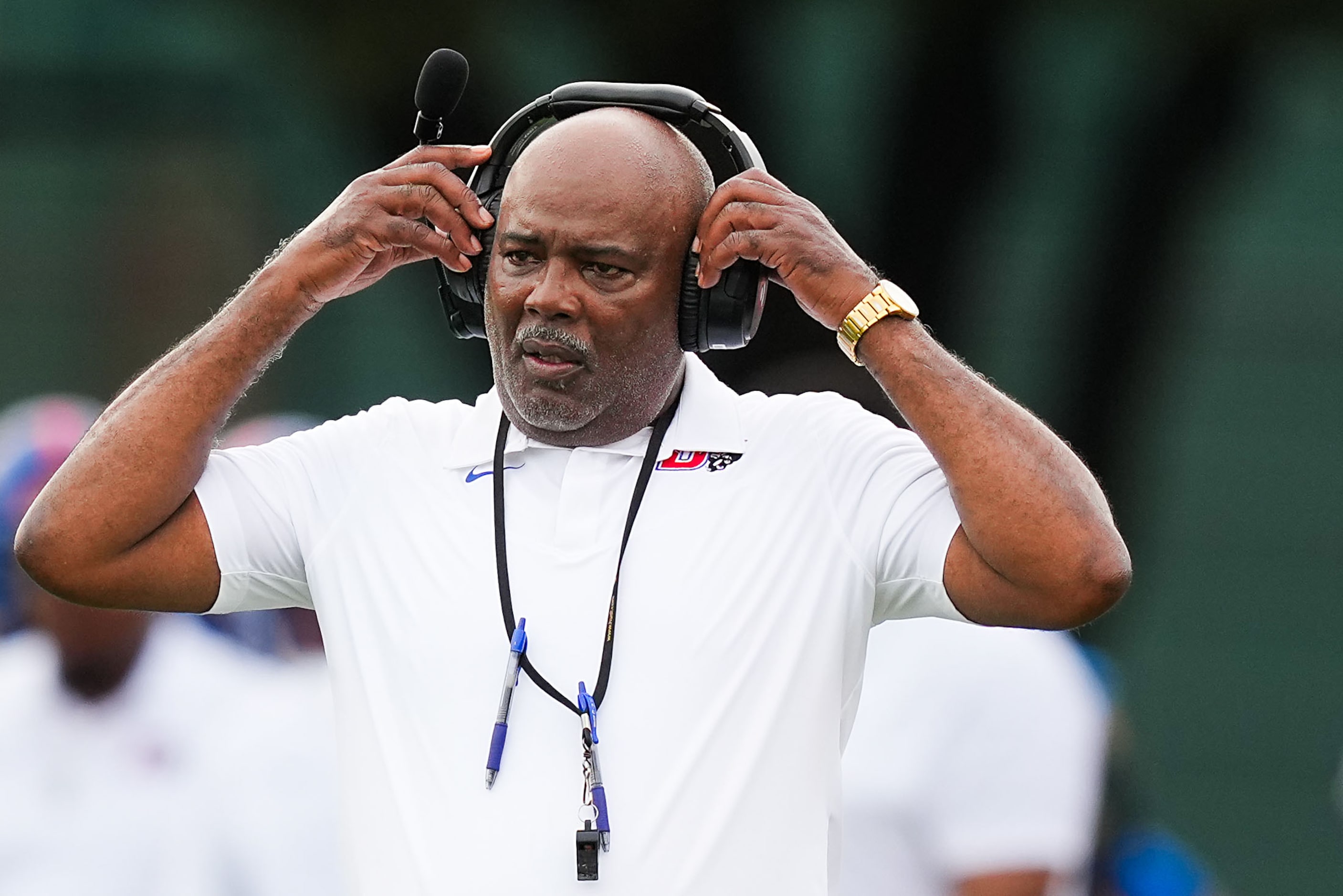 Duncanville head coach Reginald Samples works on the sidelines during a high school football...