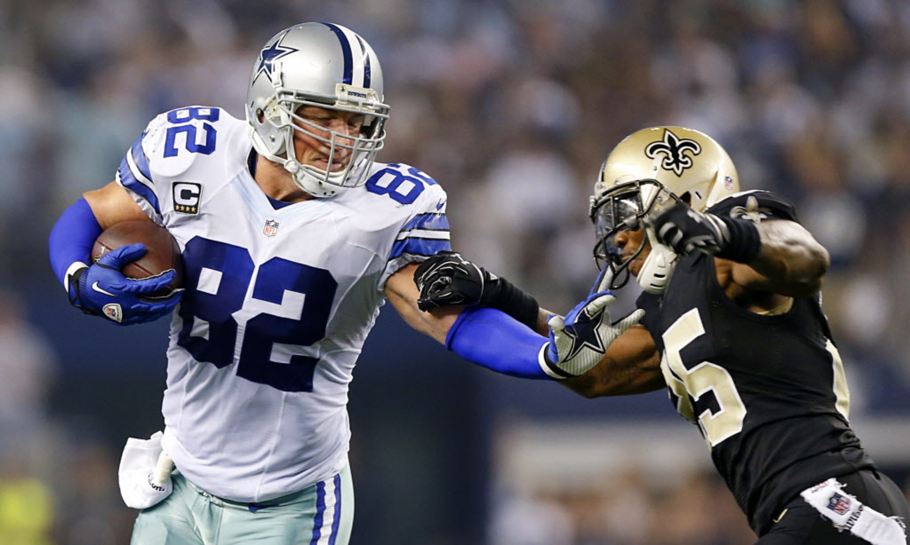 Dallas Cowboys tight end Jason Witten (82) gives New Orleans Saints free safety Rafael Bush...