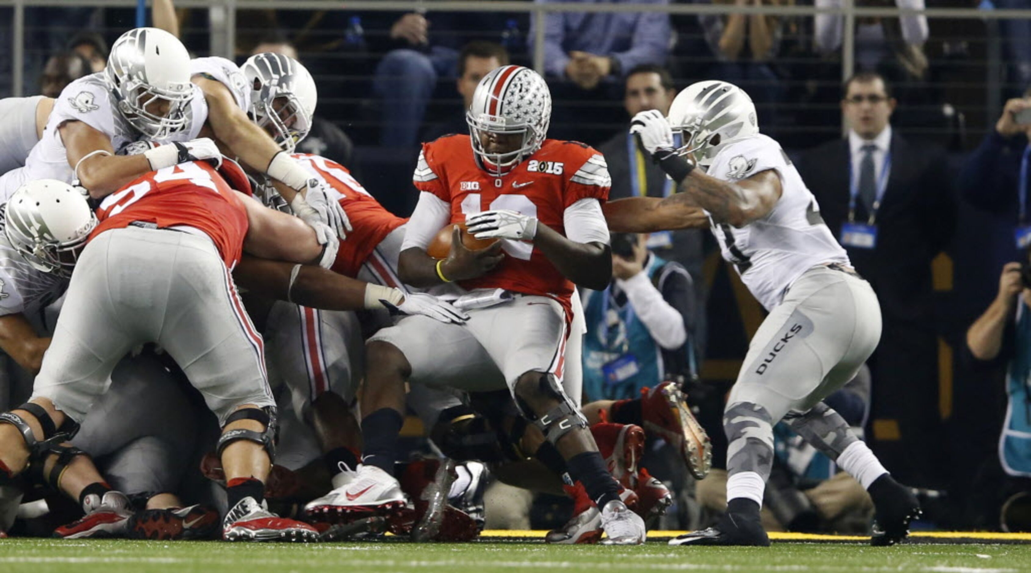 Ohio State Buckeyes quarterback Cardale Jones (12) rushes in for a touchdown on third down...