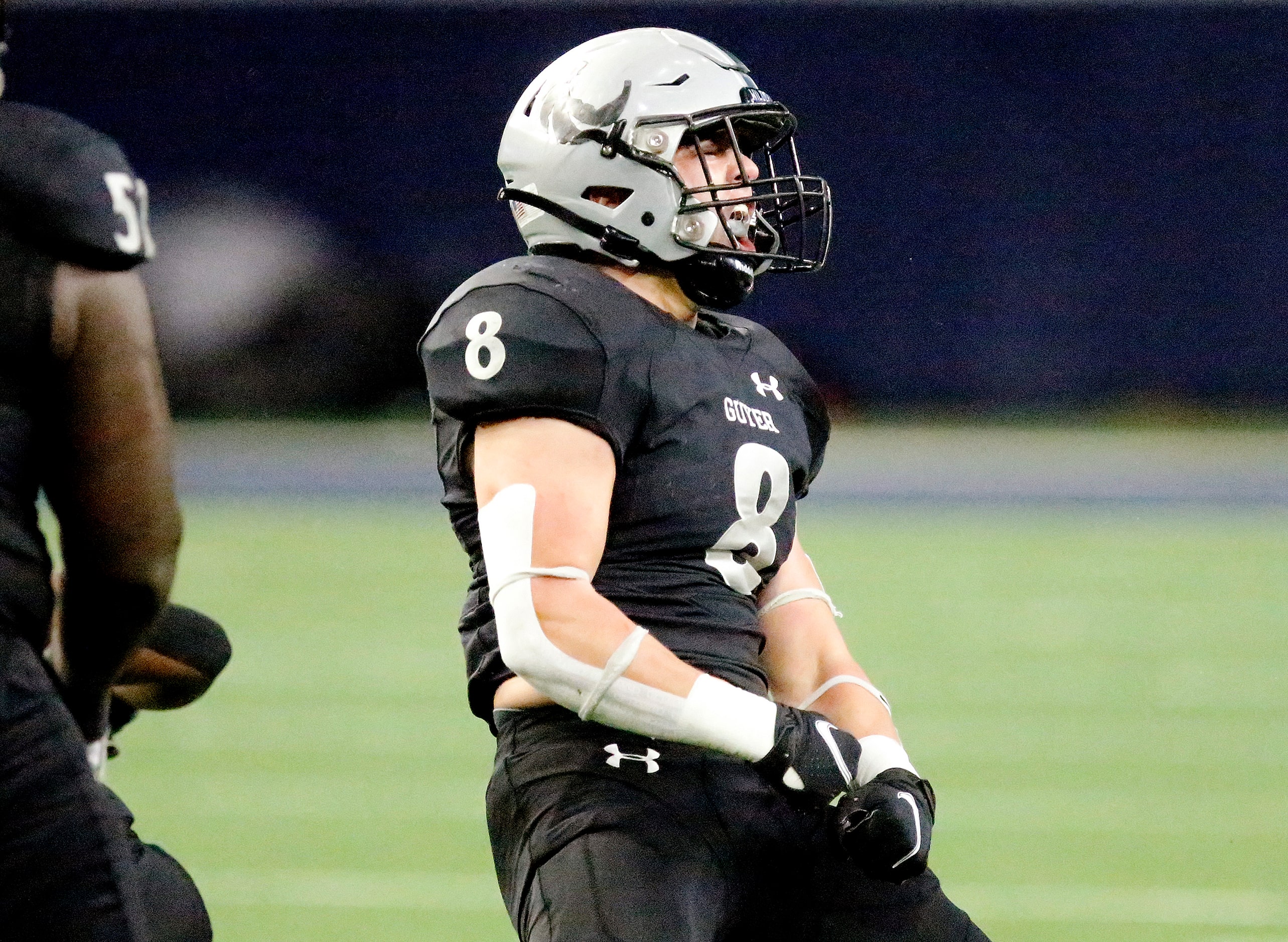 Guyer High School linebacker Blade Carver (8) celebrates a tackle during the first half as...