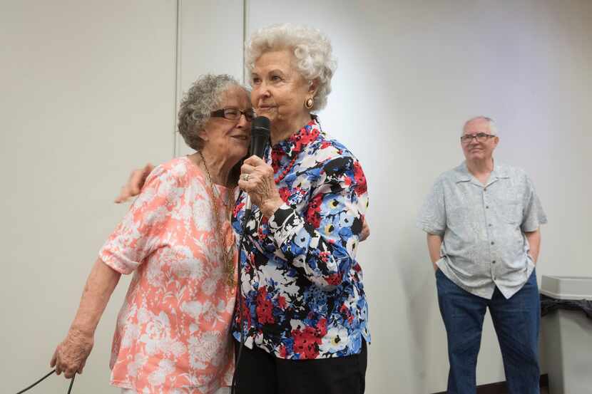 Ginnie Siena Bivona, left, hugs Barbara Mott, 92, as Mott talks about how she became an...