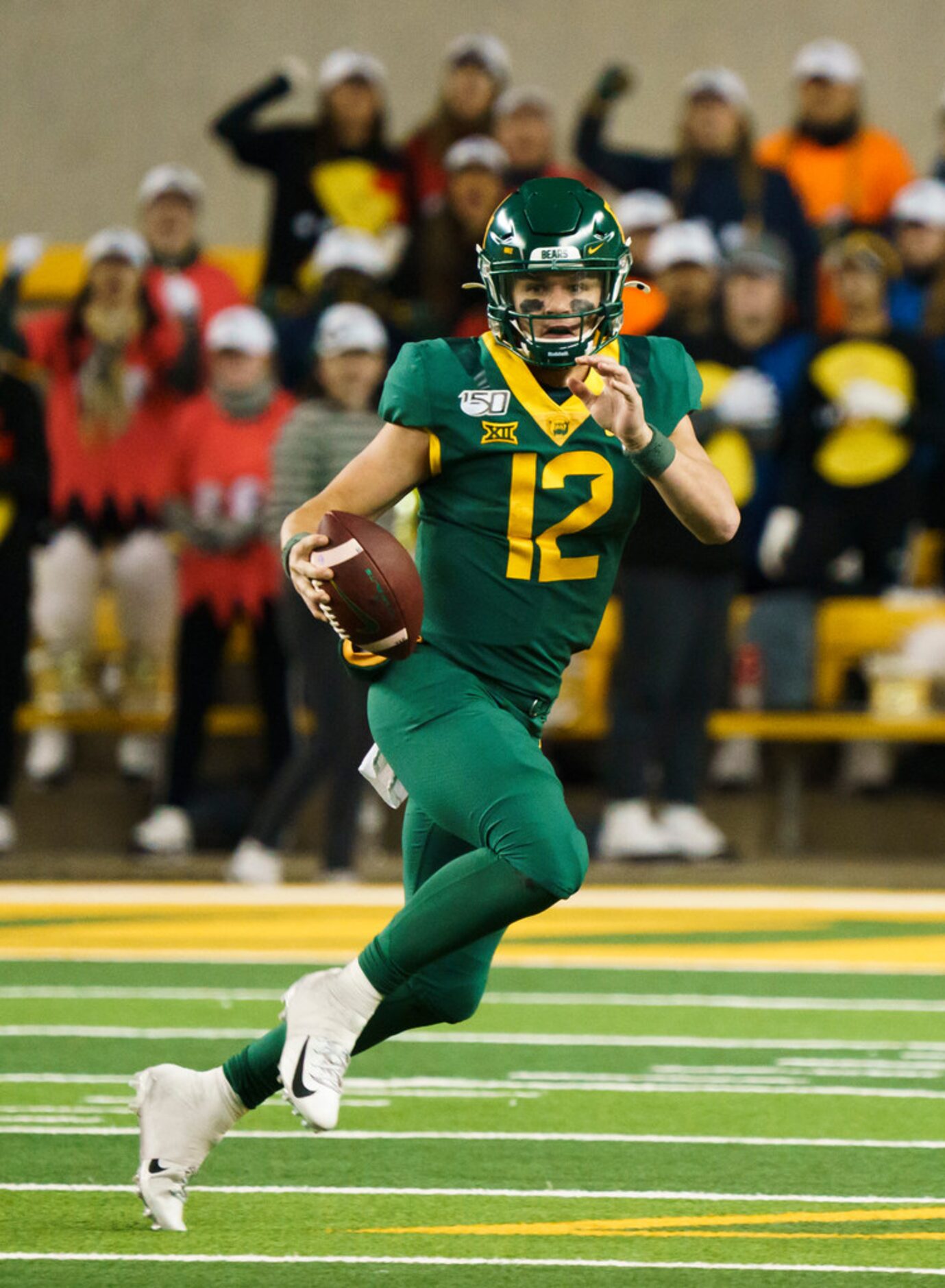 Baylor quarterback Charlie Brewer scrambles for a first down during the second half of an...