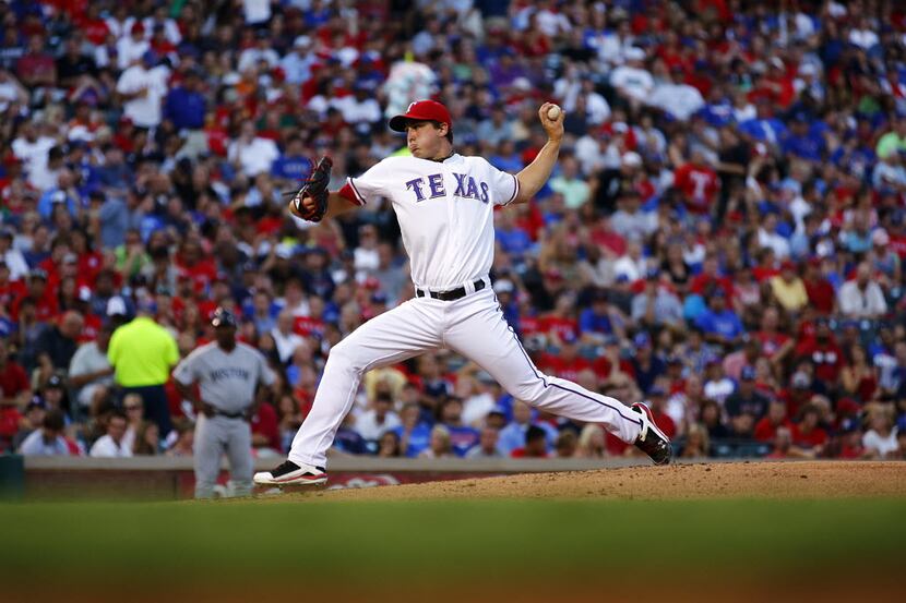 Texas Rangers starting pitcher Derek Holland (45) throws in the middle innings against the...