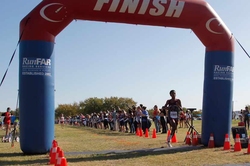 Wylie's Nathanael Berhane finishes in 2nd place with a time of 15:33.66 in the boys race....