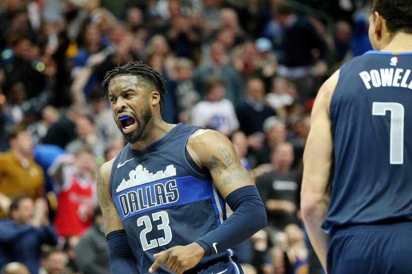 The Dallas Mavericks' Wesley Matthews (23) reacts after making a 3-point basket late in the...