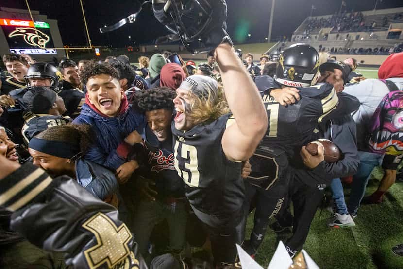 Plano East defensive lineman Killian Carper (43) celebrates with fans following their 58-44...