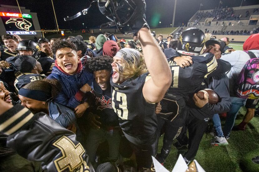 Plano East defensive lineman Killian Carper (43) celebrates with fans following their 58-44...