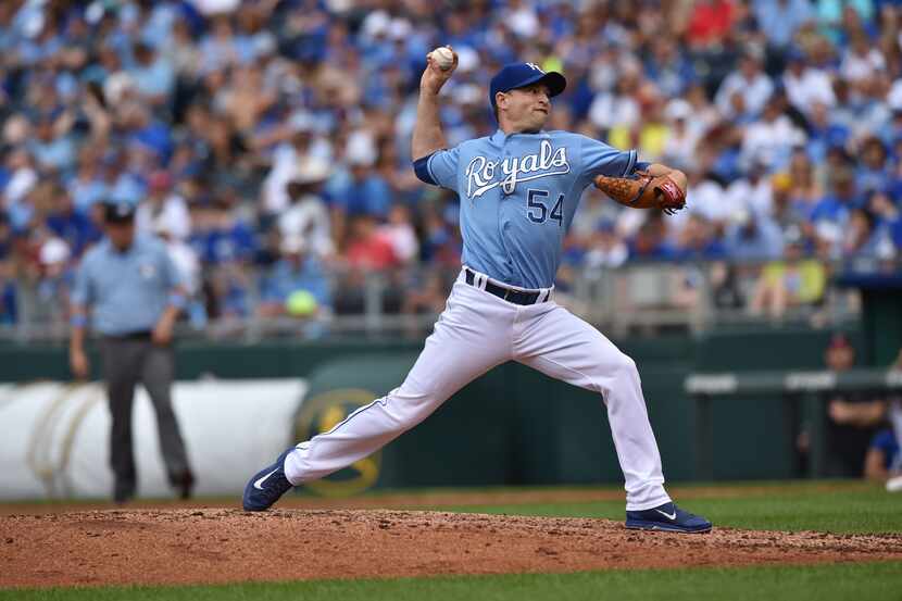 Jun 21, 2015; Kansas City, MO, USA; Kansas City Royals pitcher Jason Frasor (54) delivers a...