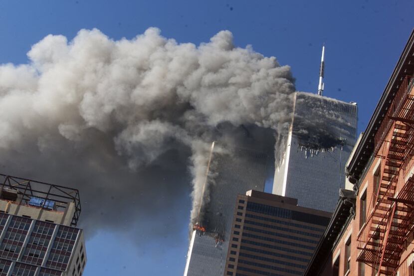 FILE - In this Sept. 11, 2001 file photo, smoke rising from the burning twin towers of the...