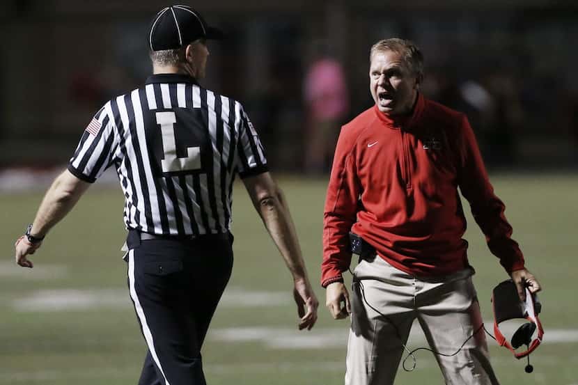FILE - Flower Mound Marcus head coach Gerry Stanford, right, argues a call with a referee...