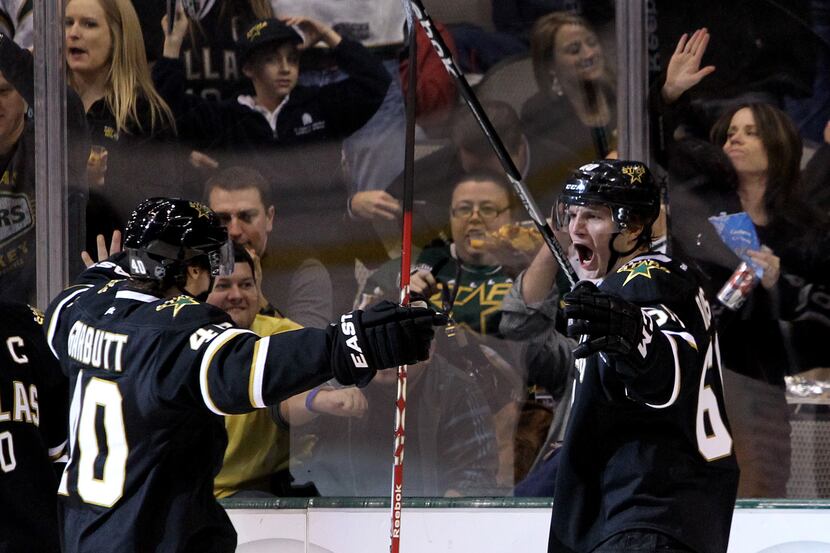 Dallas' Antoine Roussel (6) is happy about scoring his first goal as a Star as celebrates...