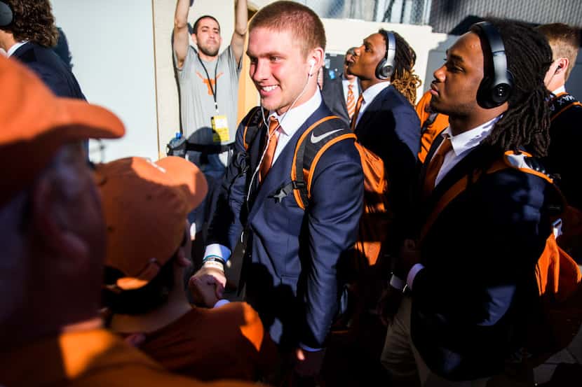Texas Longhorns quarterback Shane Buechele (middle) and teammates arrive at the Cotton Bowl...