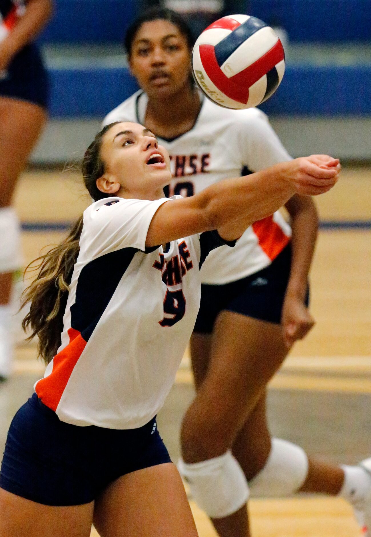 Sachse High School sett4er Claire Romo (9) keeps the volley alive during game one as Sachse...