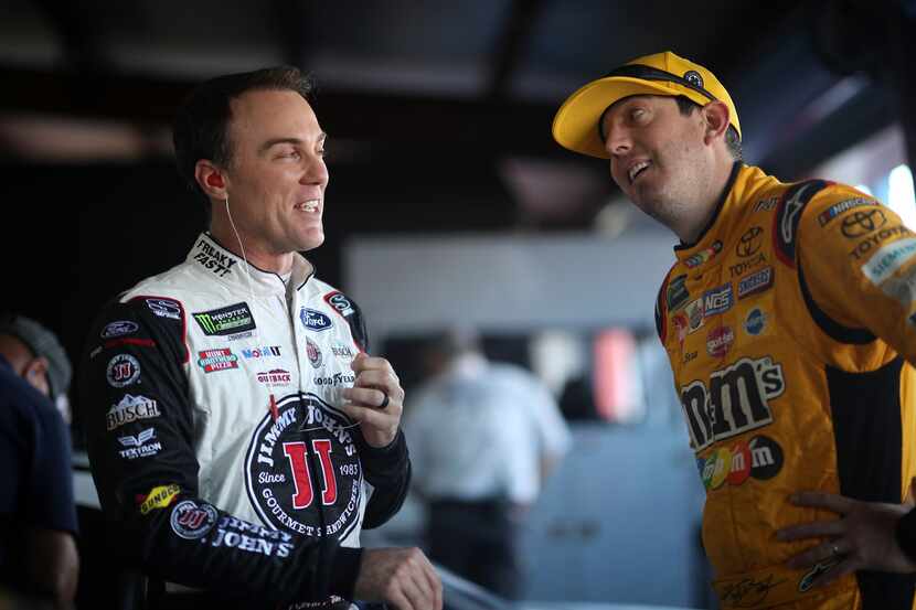 TALLADEGA, AL - OCTOBER 13:  (L- R) Kevin Harvick, driver of the #4 Jimmy John's Ford, talks...