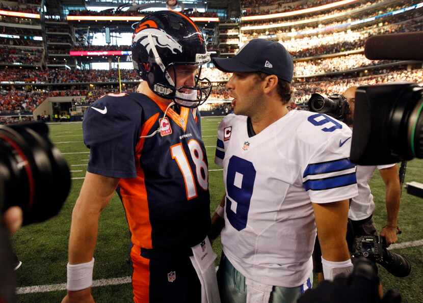 Denver Broncos quarterback Peyton Manning (18) and Dallas Cowboys quarterback Tony Romo (9)...