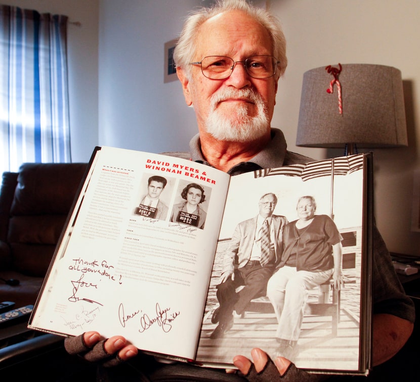 David Myers holds a copy of Breach of Peace by Eric Etheridge in his room at Mustang Creek...