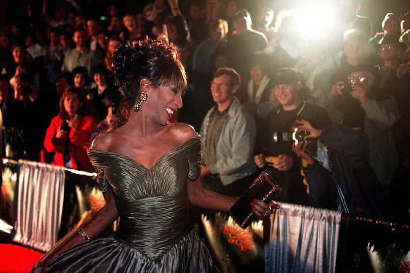 In this Thursday, Nov. 20, 1997 file photo, The Lady Chablis twirls for the crowd awaiting...