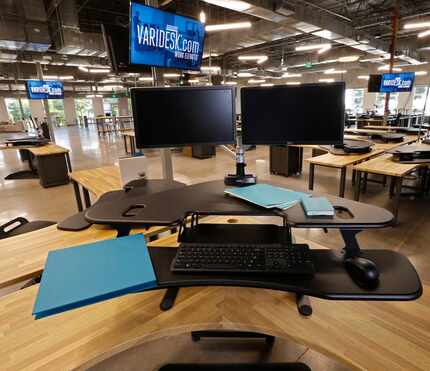 A Varidesk desk that allows you to stand or sit.  (Nathan Hunsinger/Staff Photographer)